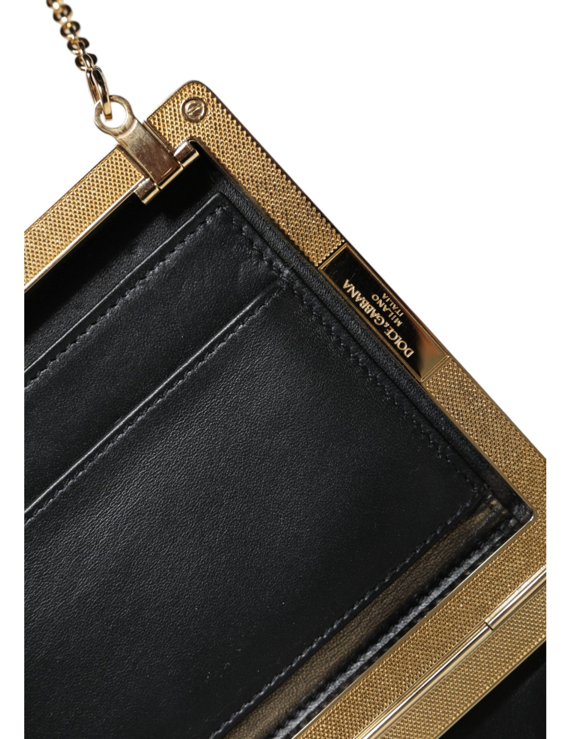 Black leather wallet with gold accents