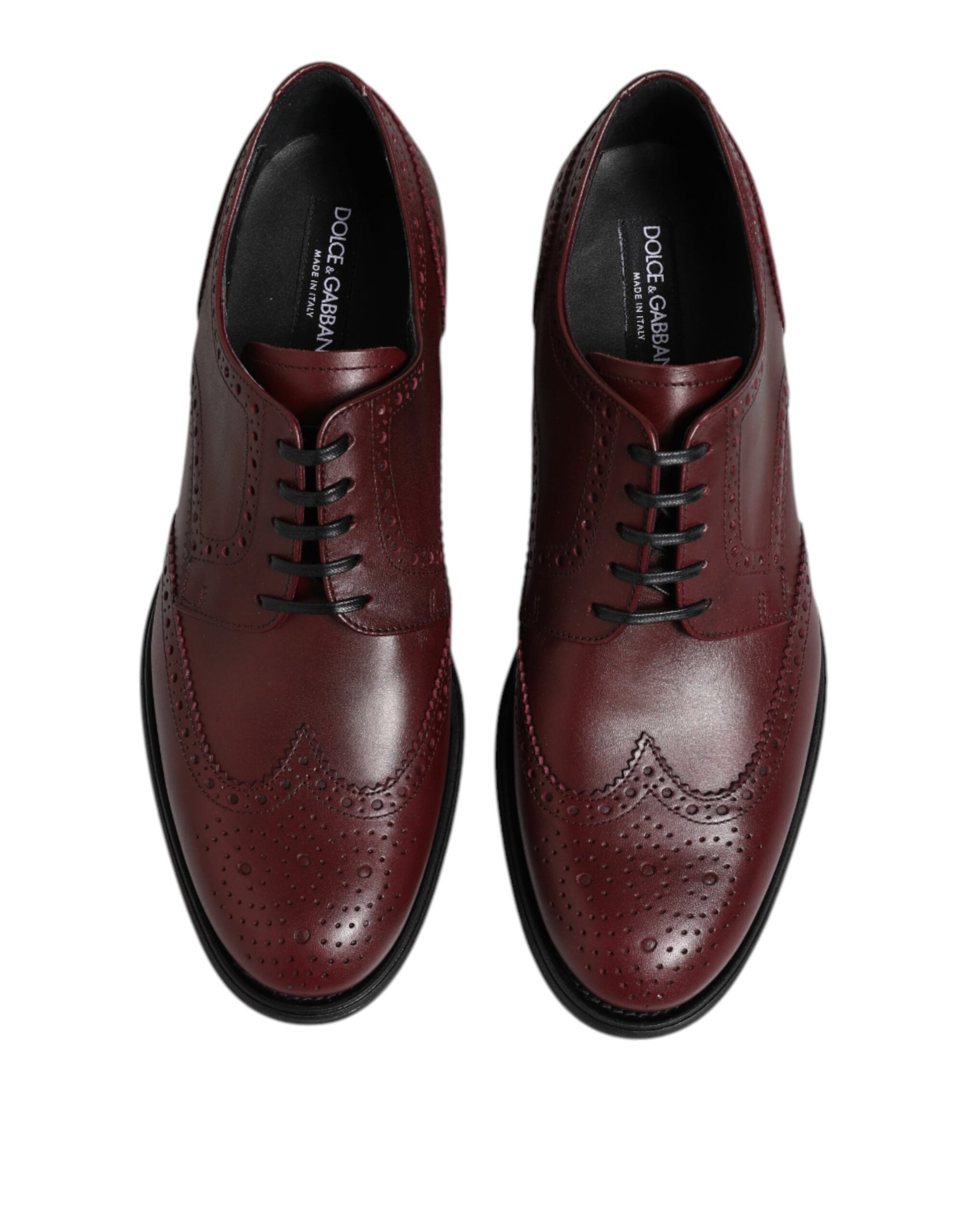 Pair of brown leather lace-up dress shoes with a wingtip design, featuring the brand name on the tongue