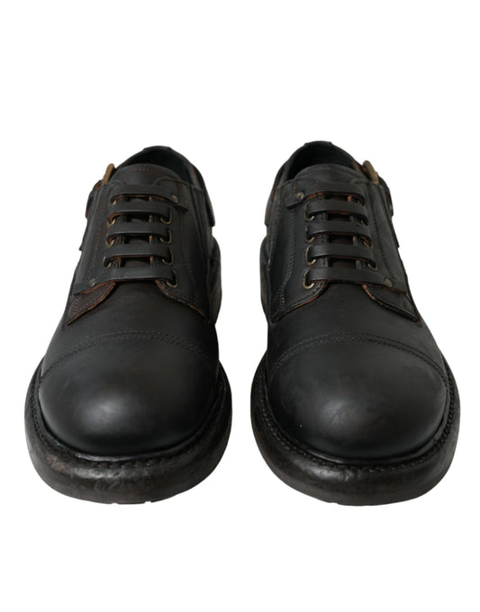 Pair of black leather shoes with laces