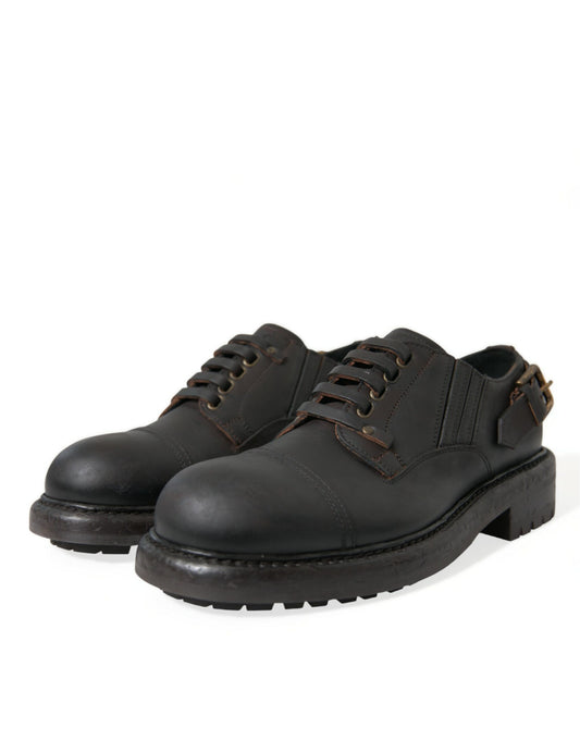 Pair of black leather shoes with laces and a small heel