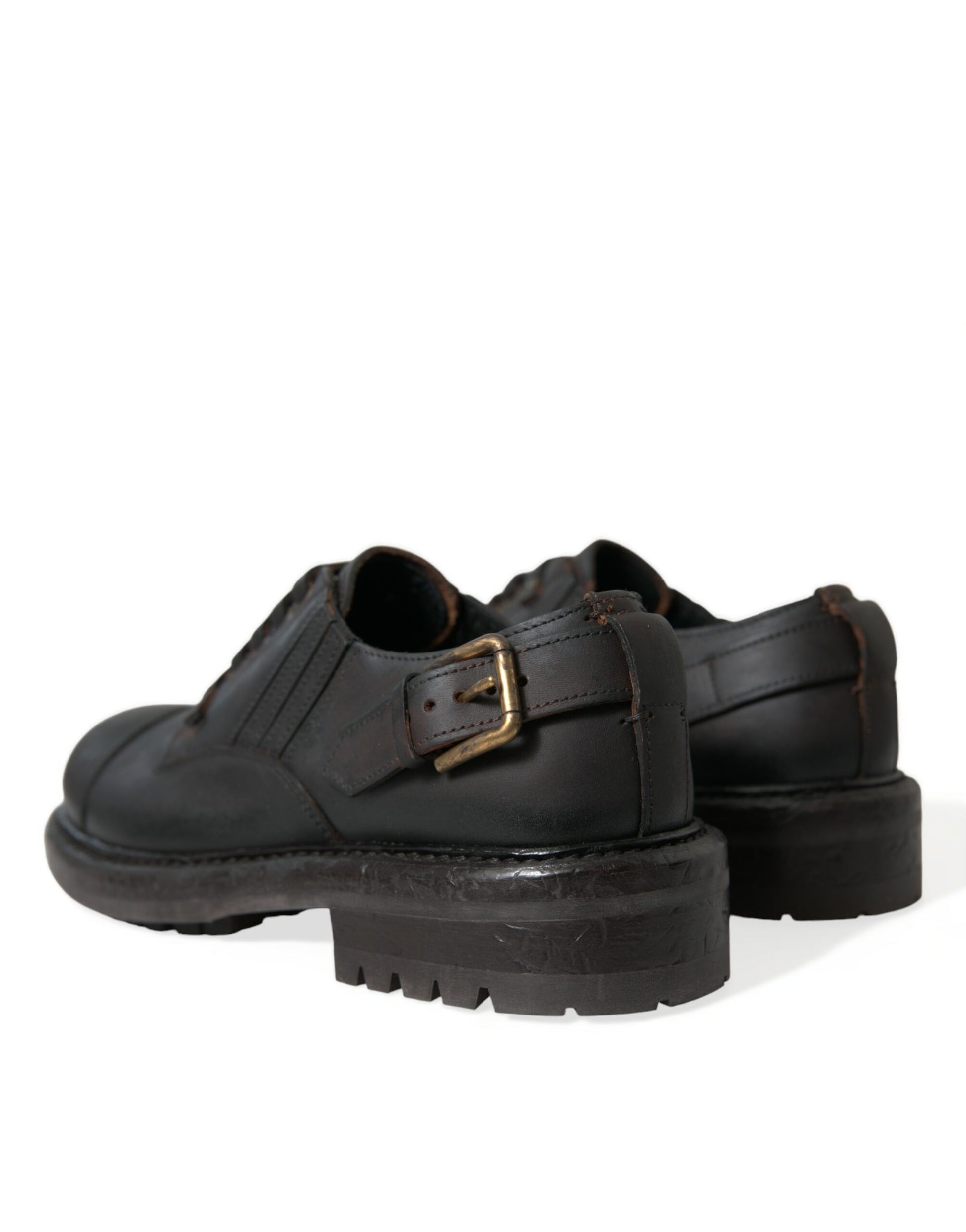 Pair of black leather shoes with chunky heels and buckle straps