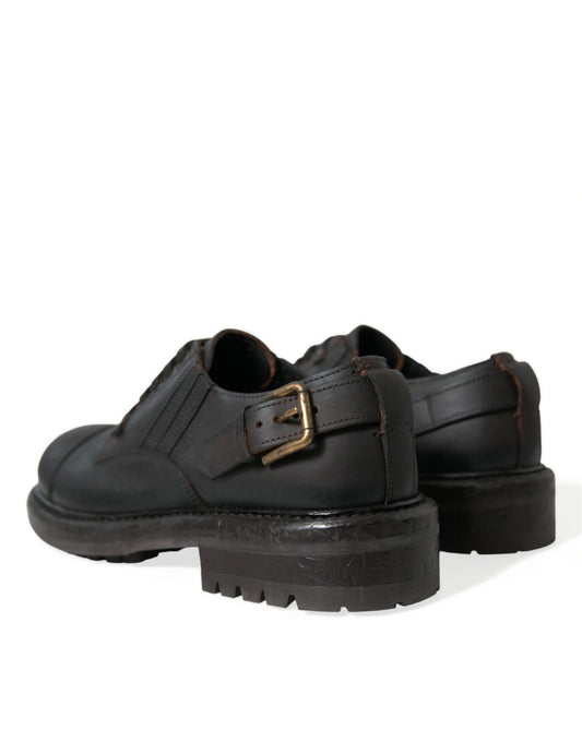 Pair of black leather shoes with chunky heels and buckle straps