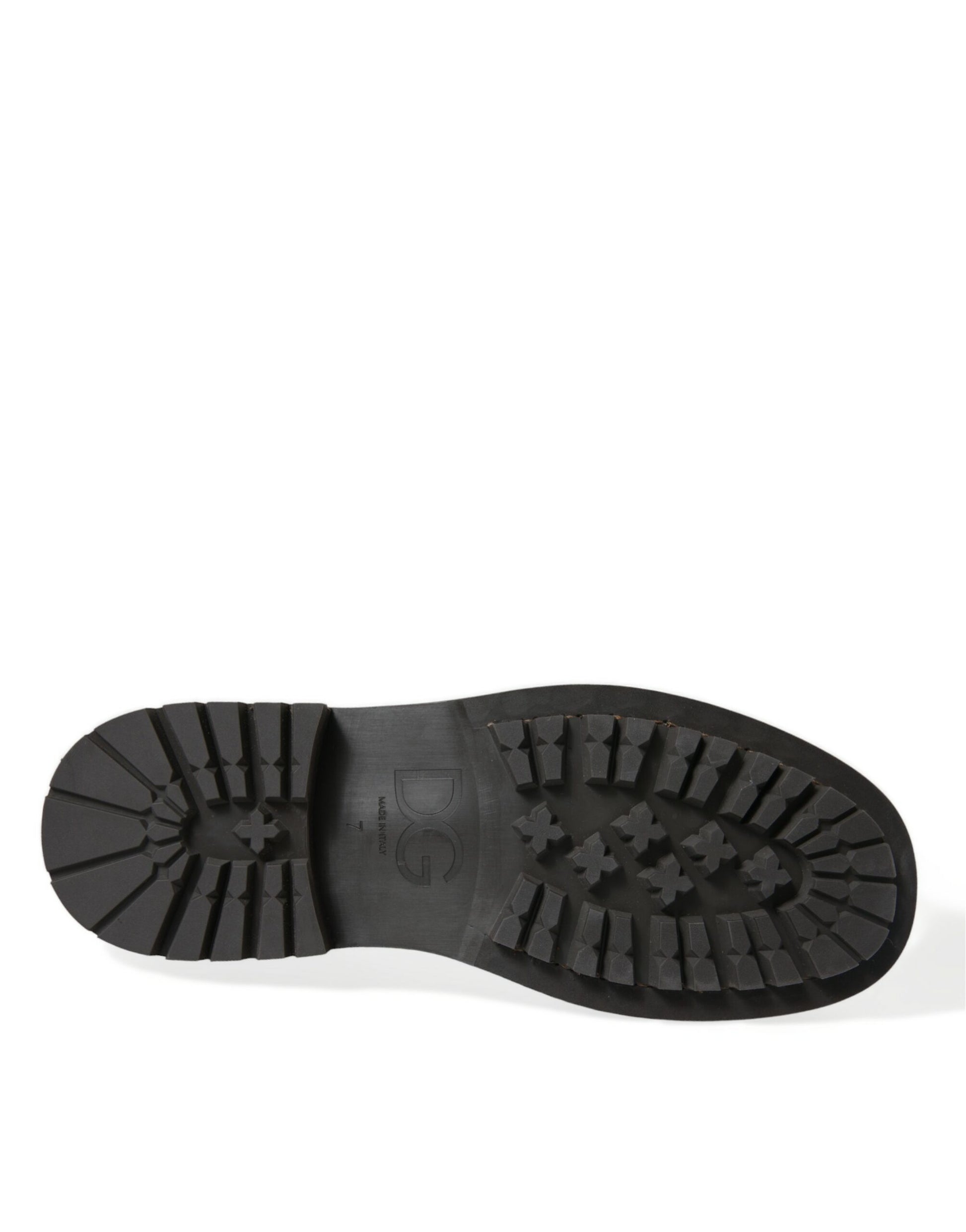 Black rubber boot with treads on sole