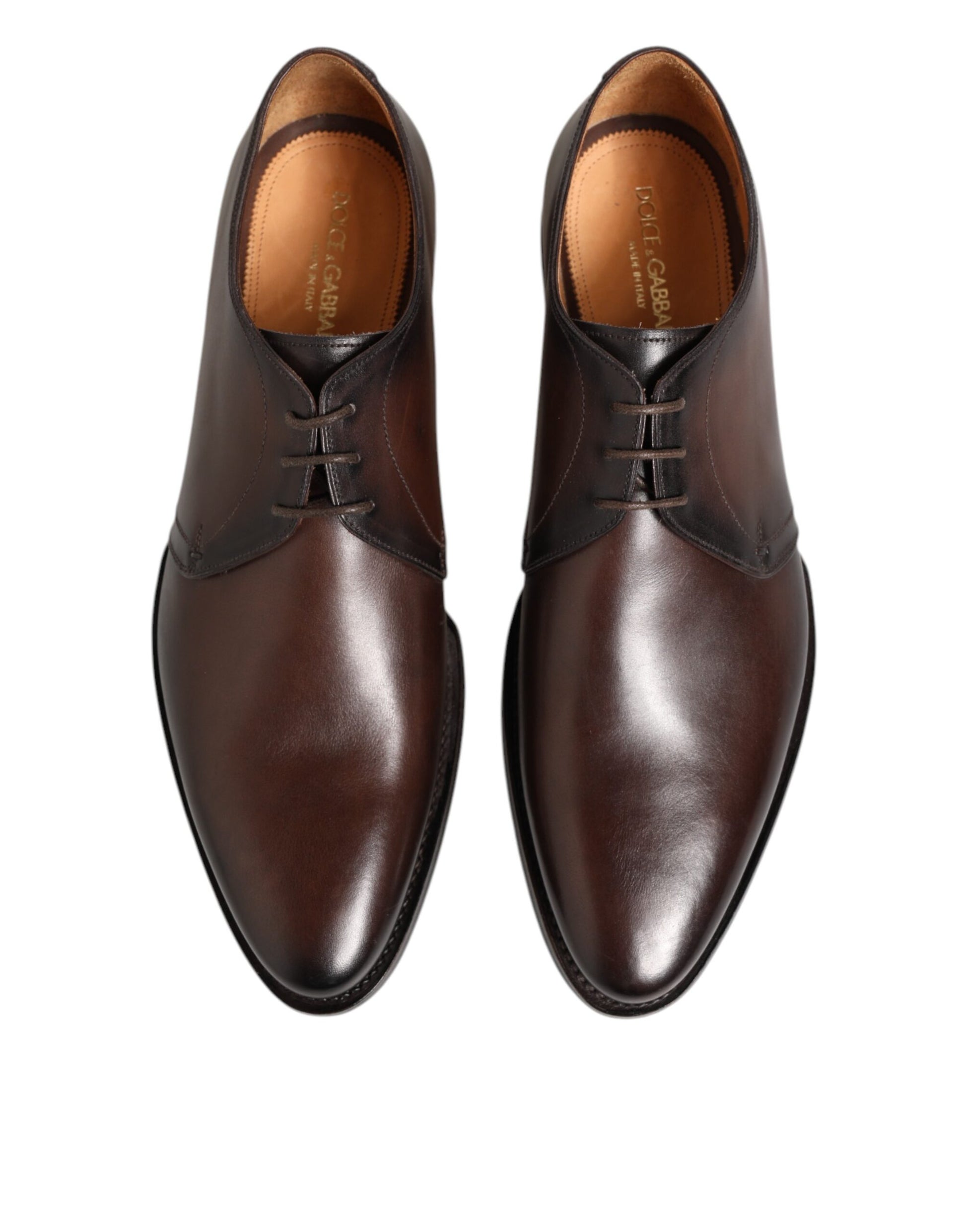 Pair of brown leather lace-up dress shoes with a shiny finish, featuring a classic design and a low heel