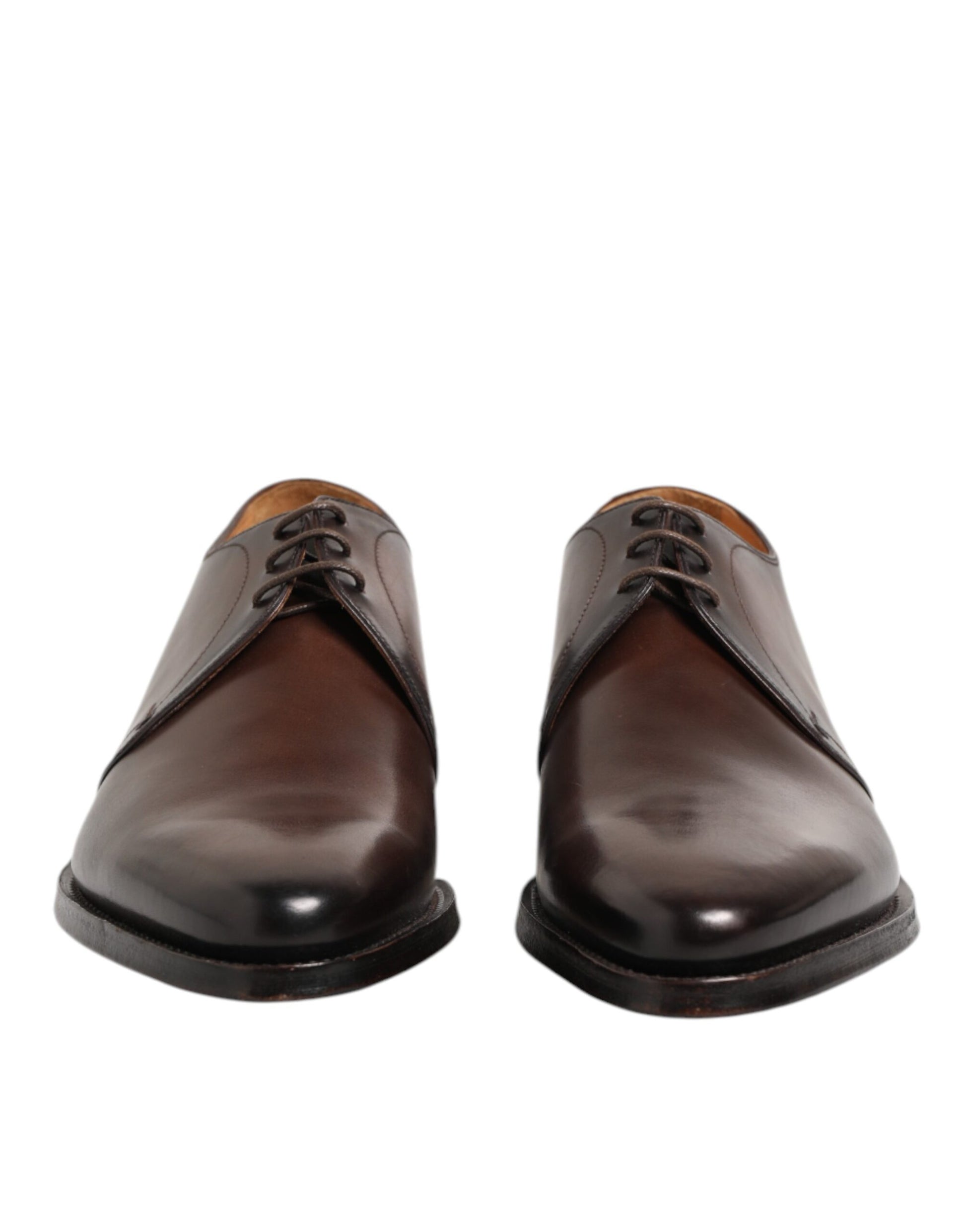 Pair of brown leather lace up dress shoes with a shiny finish, featuring a classic derby design