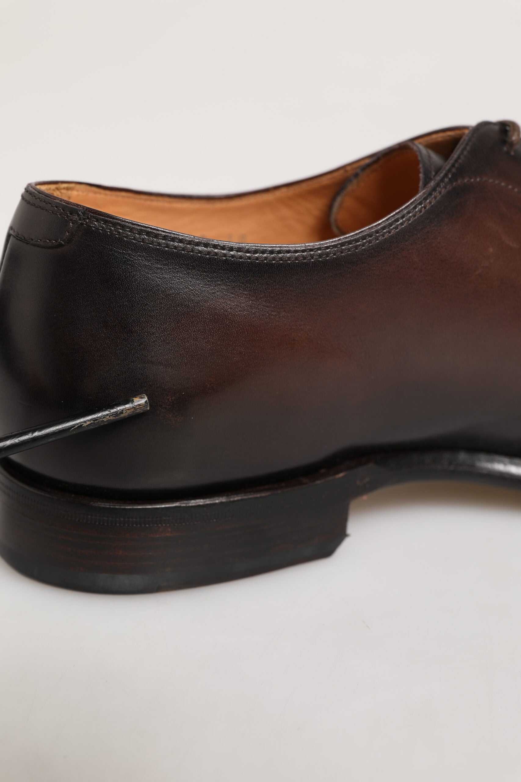 A pair of brown leather lace up dress shoes with a small heel, designed by Dolce & Gabbana