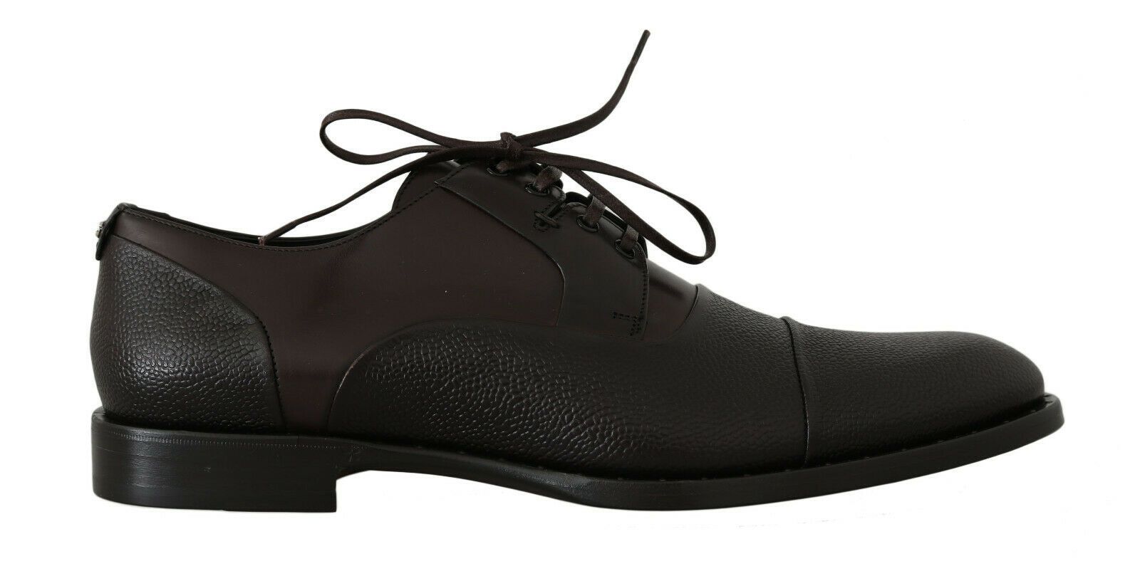Pair of black dress shoes with laces and a bow on top