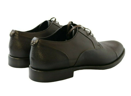 Pair of black leather shoes with laces and a small heel