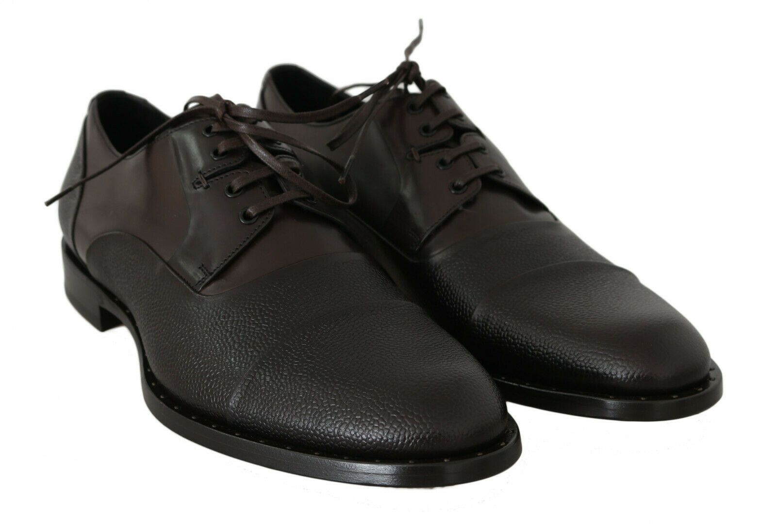 Pair of black leather shoes with laces and a small heel