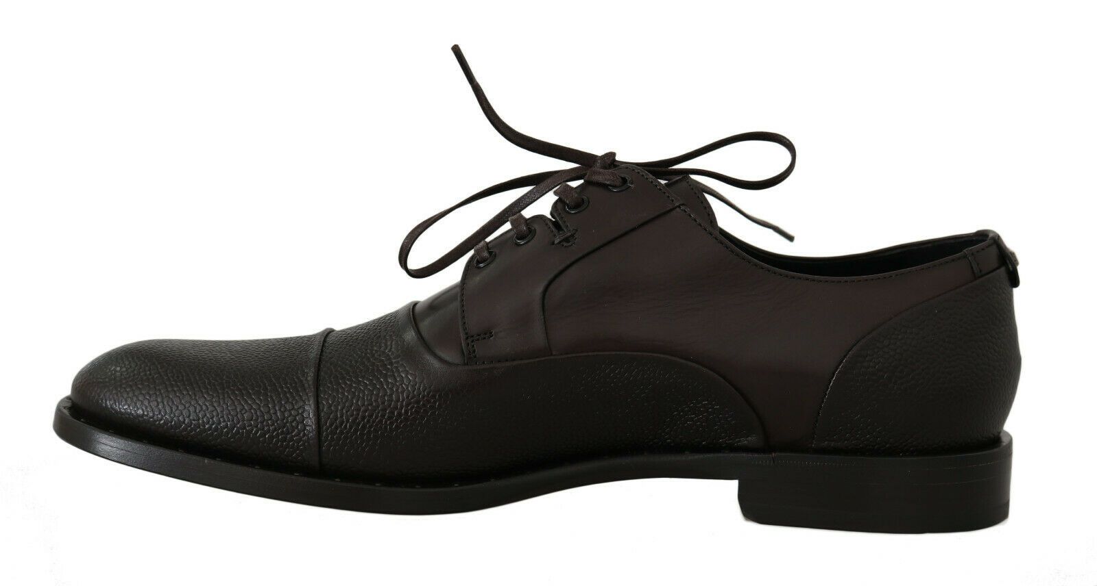 Pair of black dress shoes with laces and a bow on top