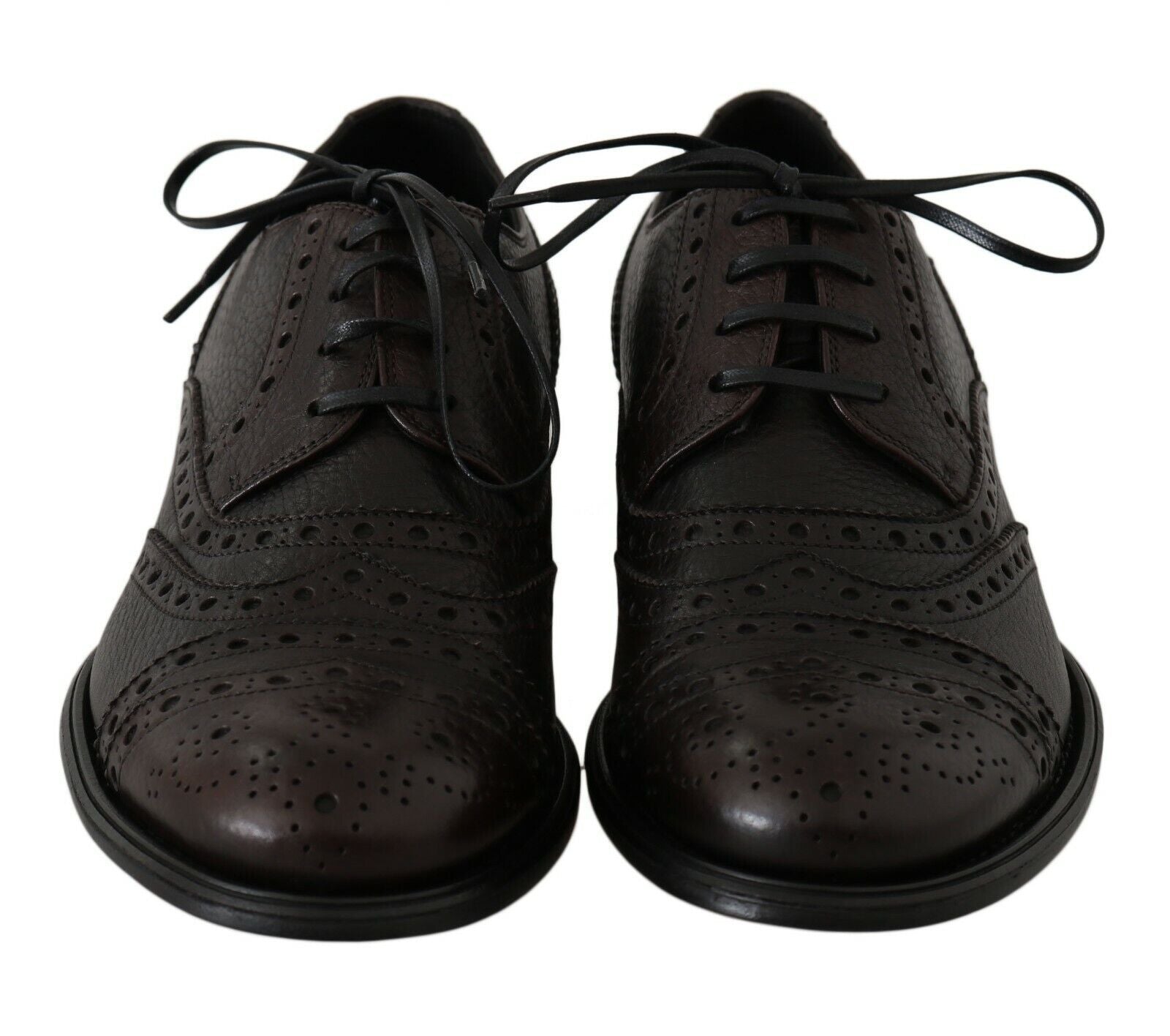 Pair of brown leather shoes with laces tied in bow