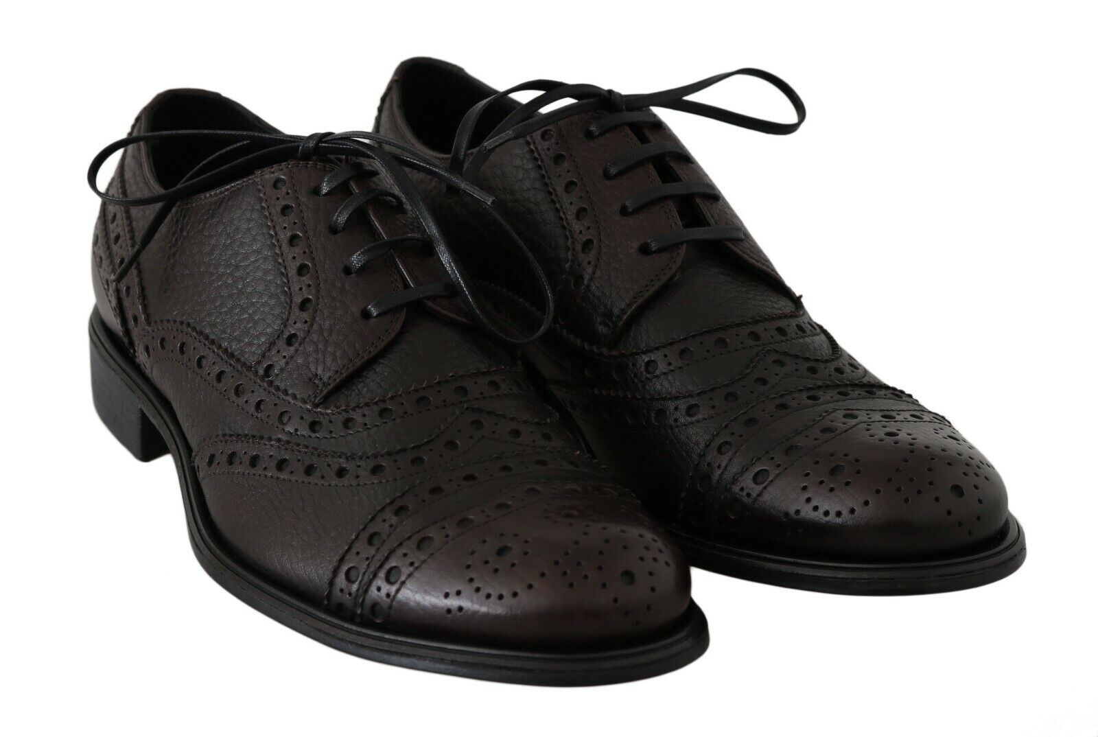 Pair of brown leather shoes with laces and perforated design