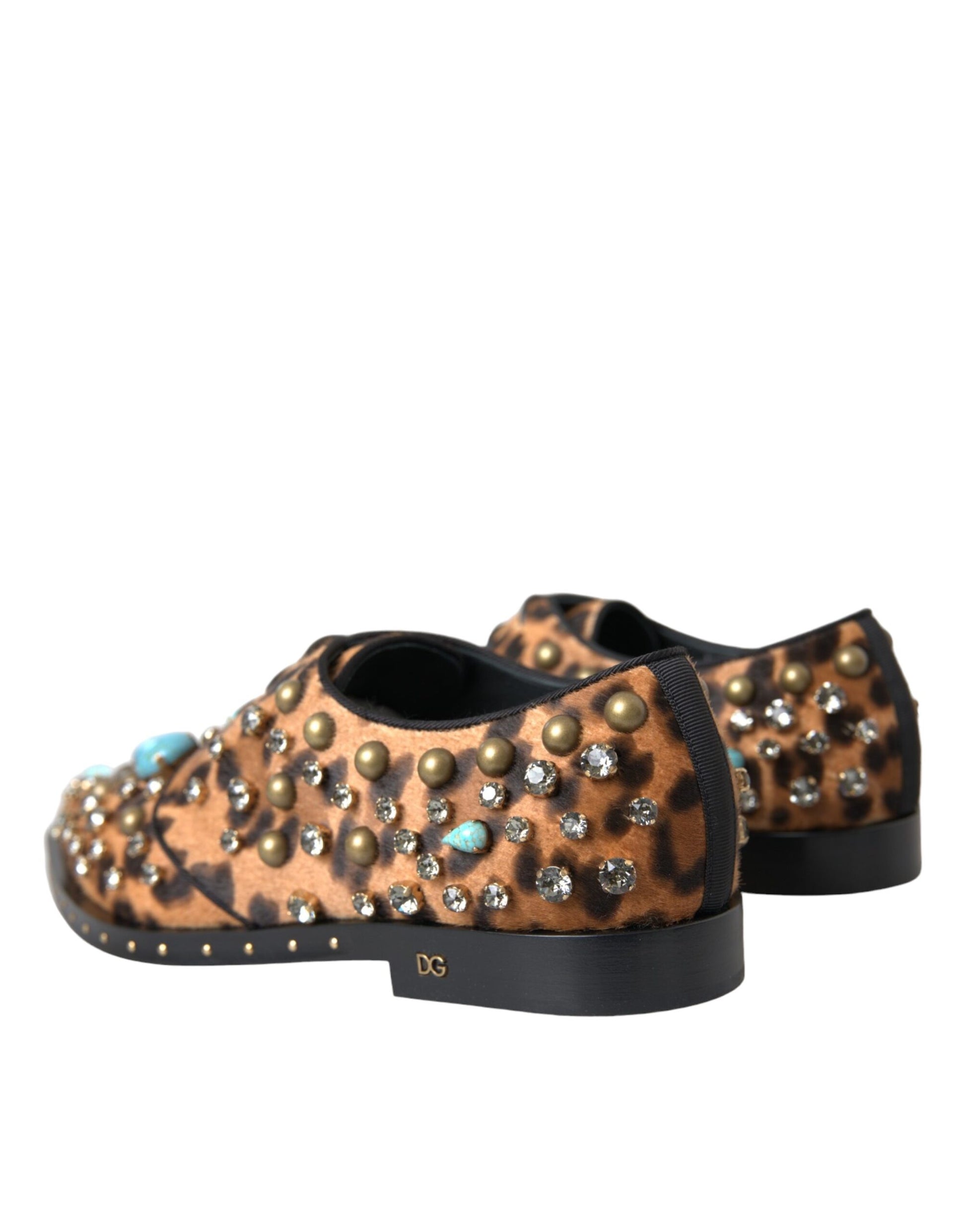 Pair of children's shoes with animal print and studded detailing