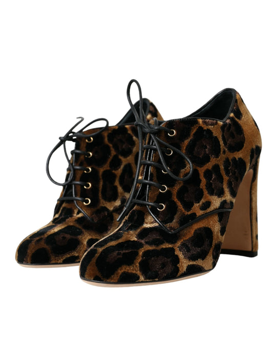 Pair of women's boots with animal print design and lace-up detailing