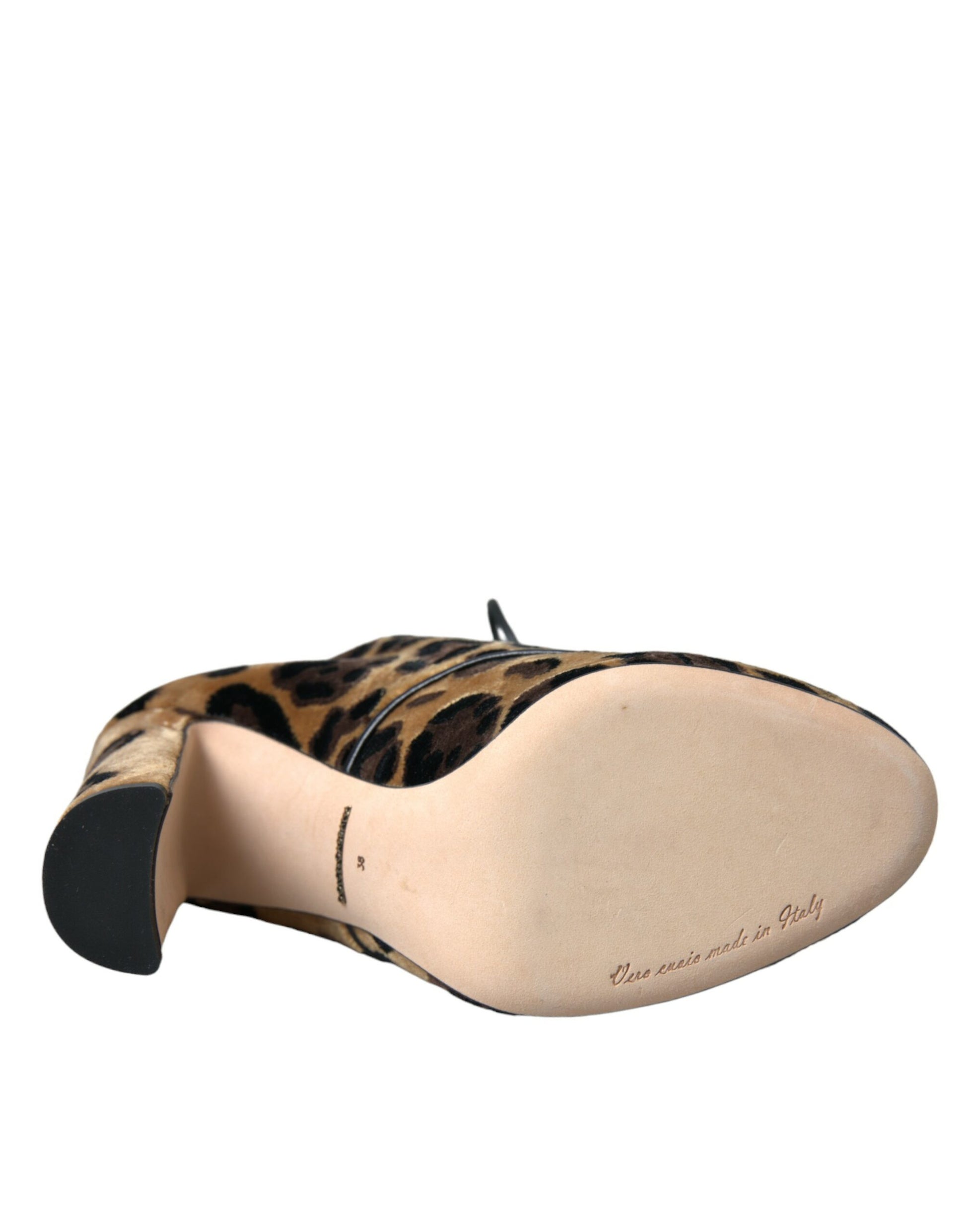 A single shoe against a plain background. It appears to be a women's flat with a pointed toe and a low heel. The upper pa