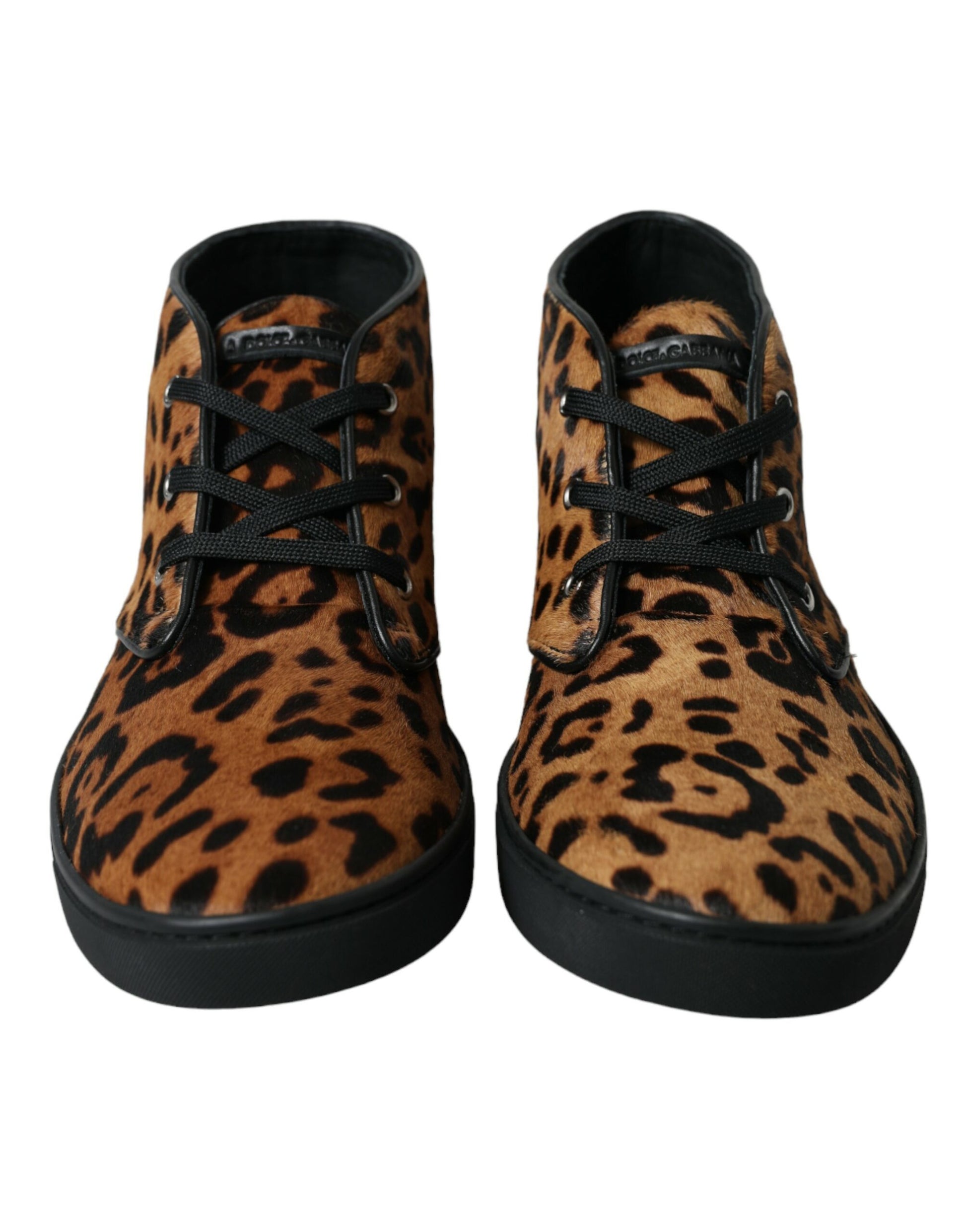 Pair of black and brown leopard print boots with laces