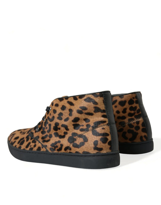 Leopard print suede ankle boots with black soles and laces
