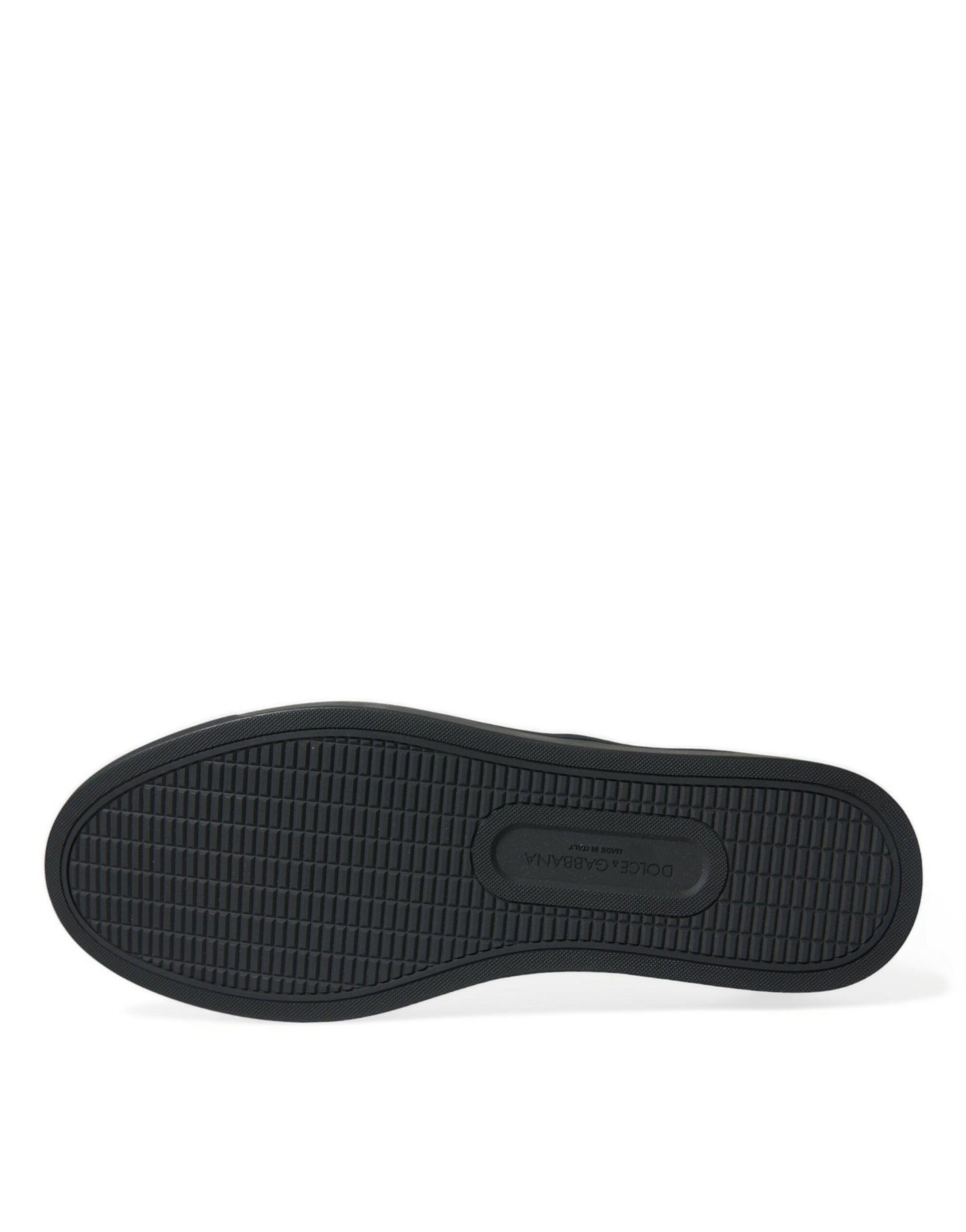 Black shoe with a rubber sole and lace eyelets