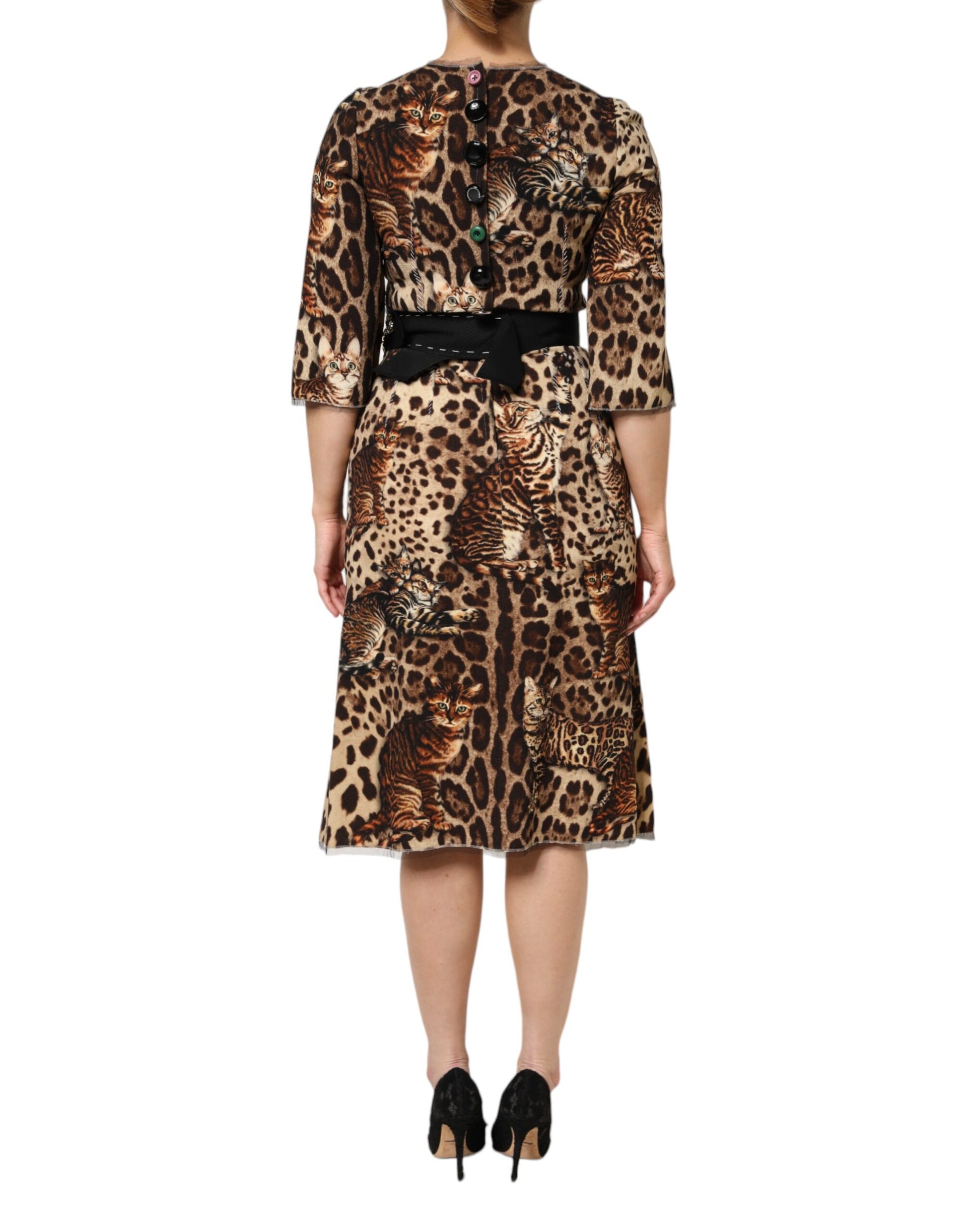A midi dress with a brown leopard print design, featuring a belt at the waist