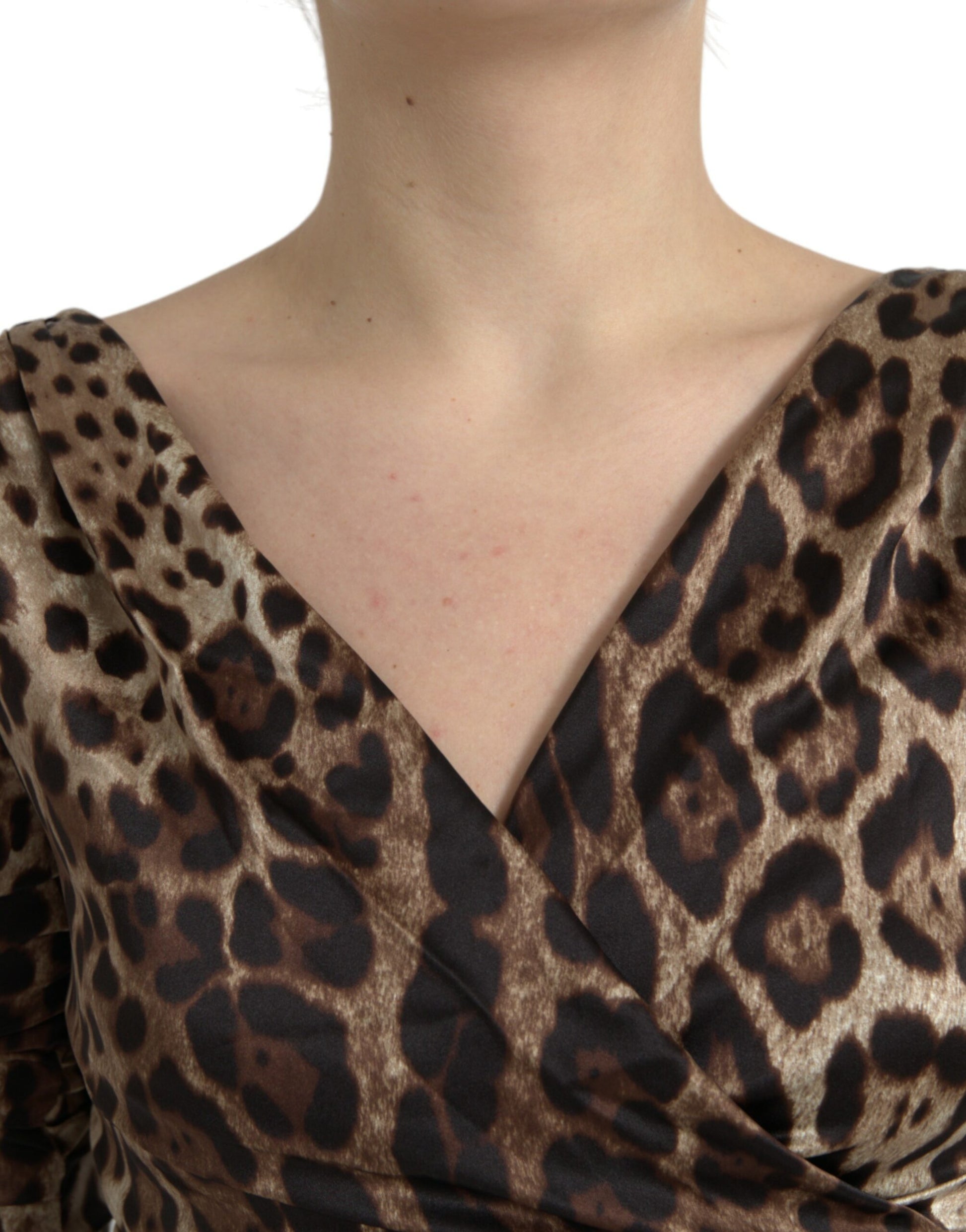 A brown leopard print bodycon dress with a V-neck and midi length