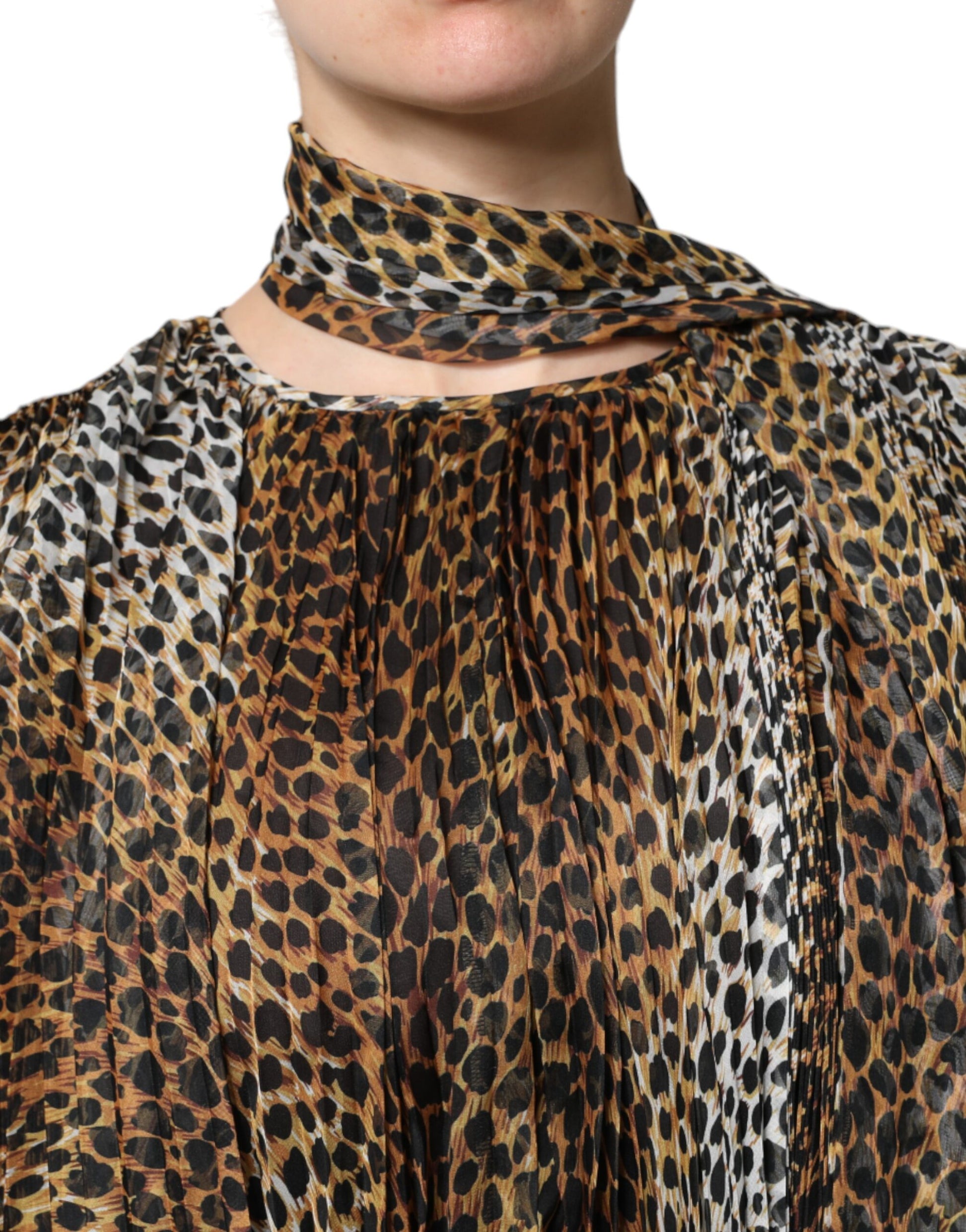 A brown leopard print scarf collared chiffon dress