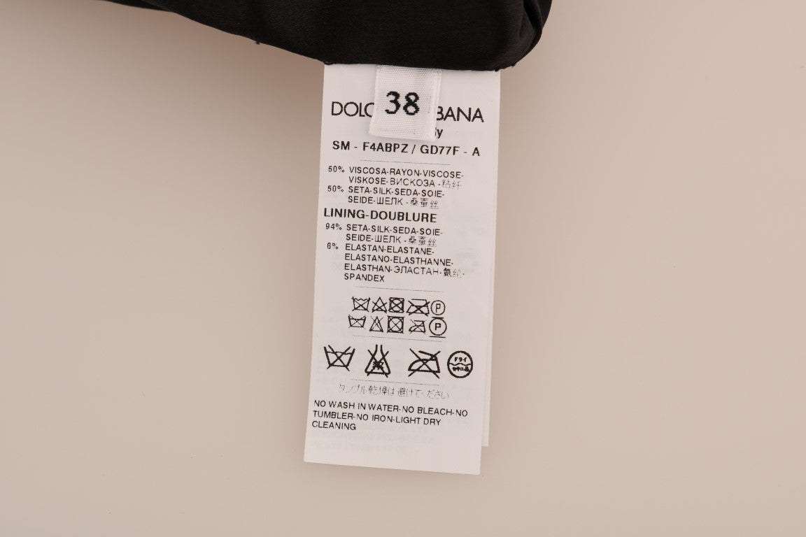 Tag on black fabric with white lettering and symbols