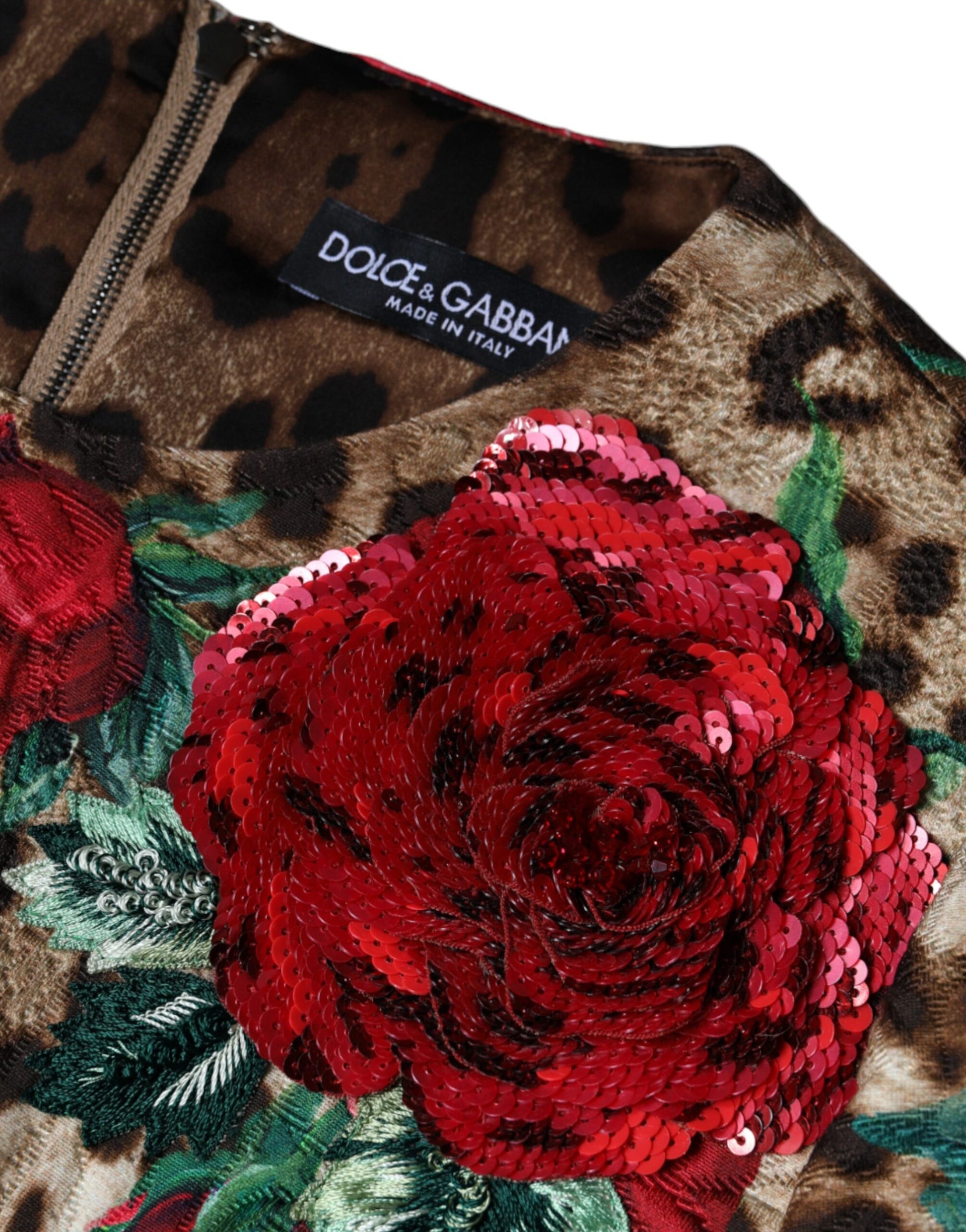 A brown leopard print dress with red roses and a floral pattern on the front
