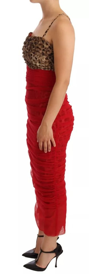 A red tulle midi dress with a brown leopard print bodice and sheer sleeves