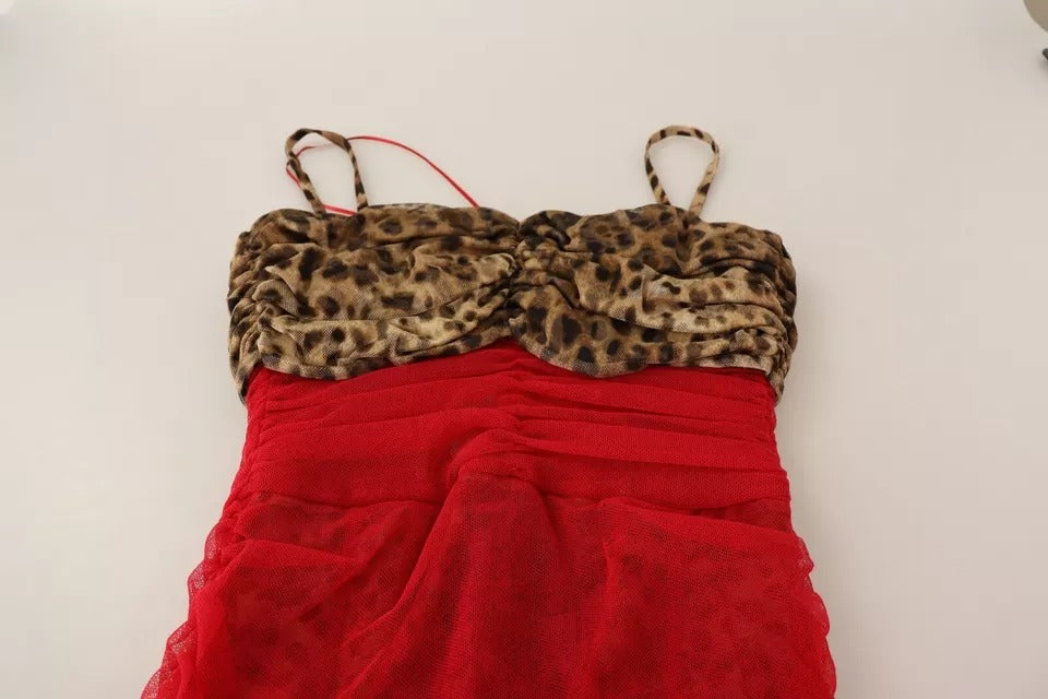 A red tulle midi dress with brown leopard print straps and a sheer overlay