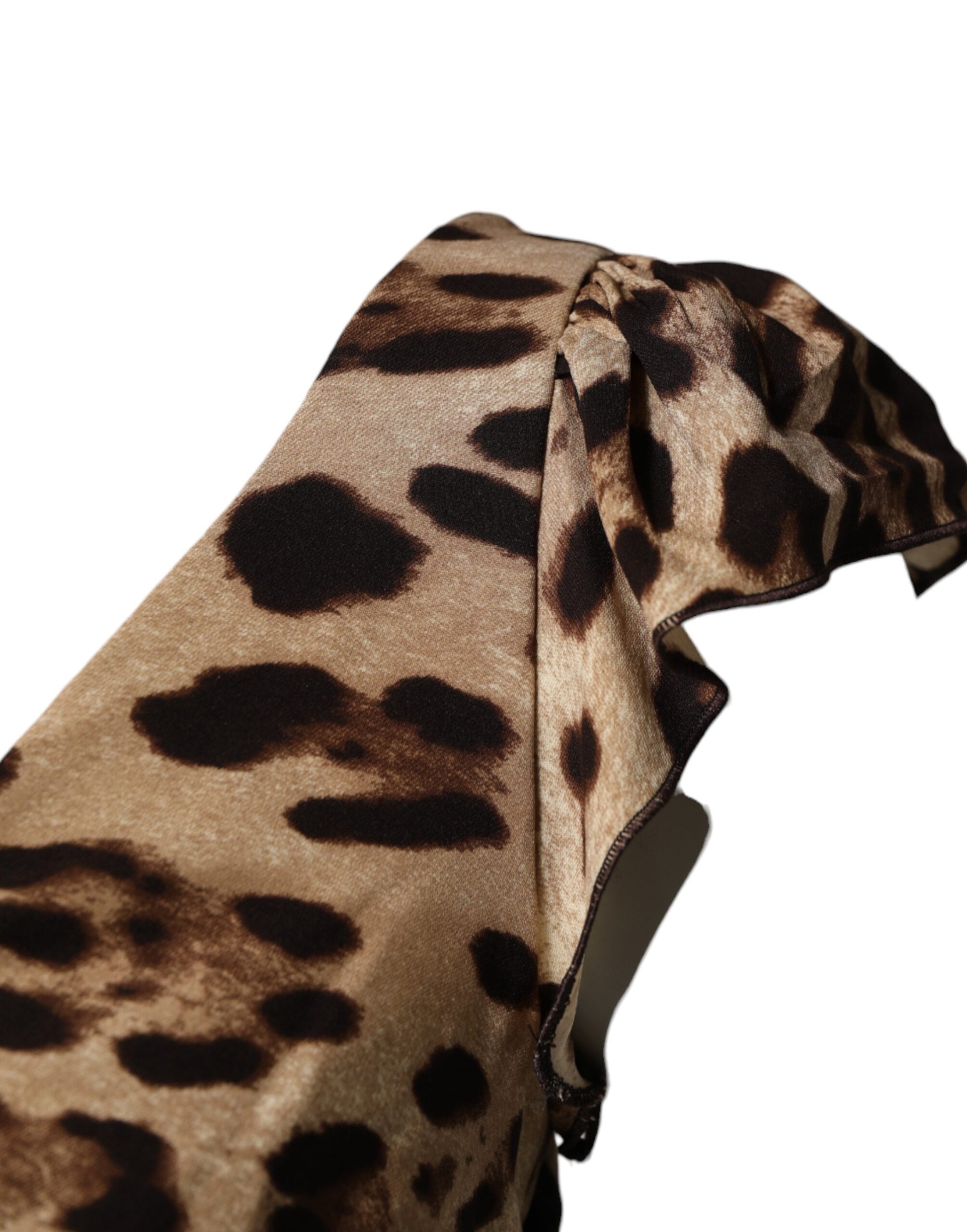 A brown leopard print sleeveless sheath midi dress