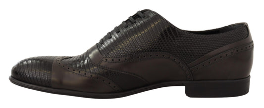 Pair of men's dress shoes with a patterned design and lace closure