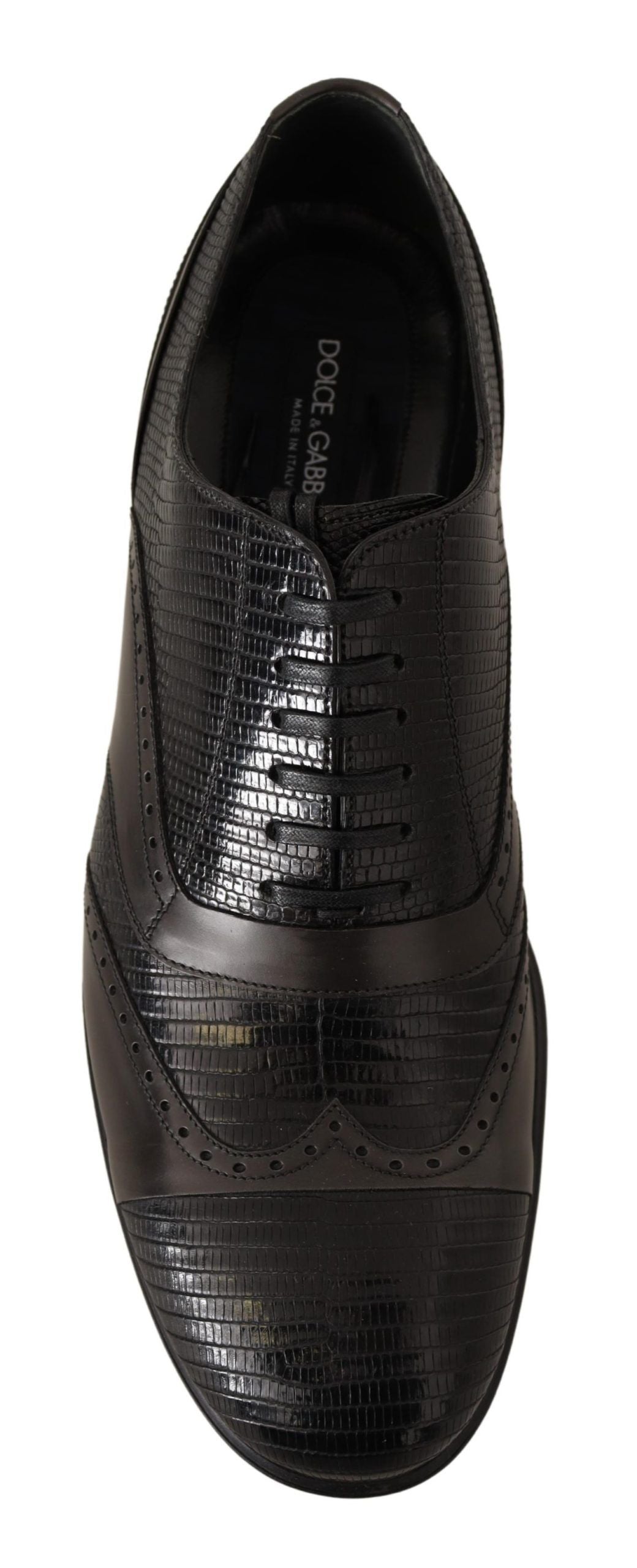 Black dress shoe with a patterned design and laces