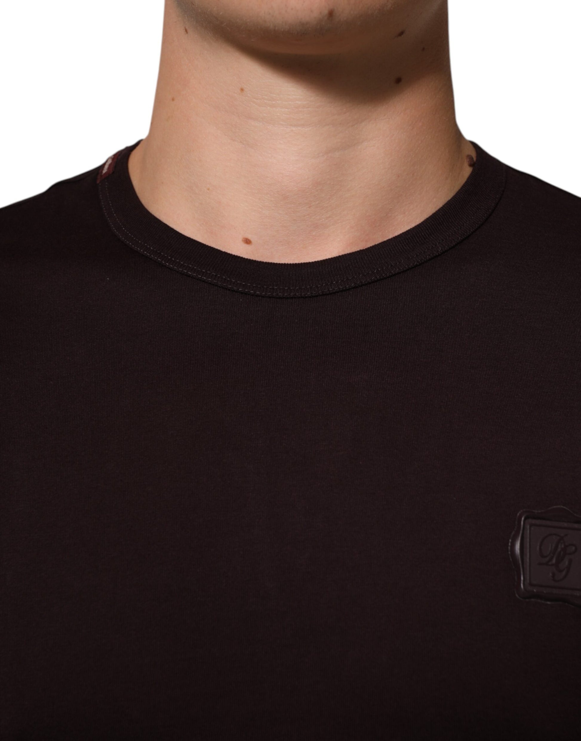 Black shirt with a logo on the left chest area
