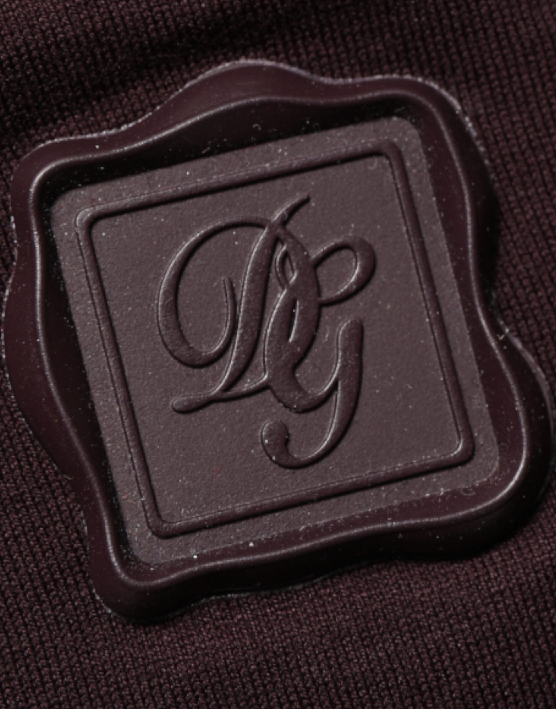 Chocolate logo on a dark fabric background