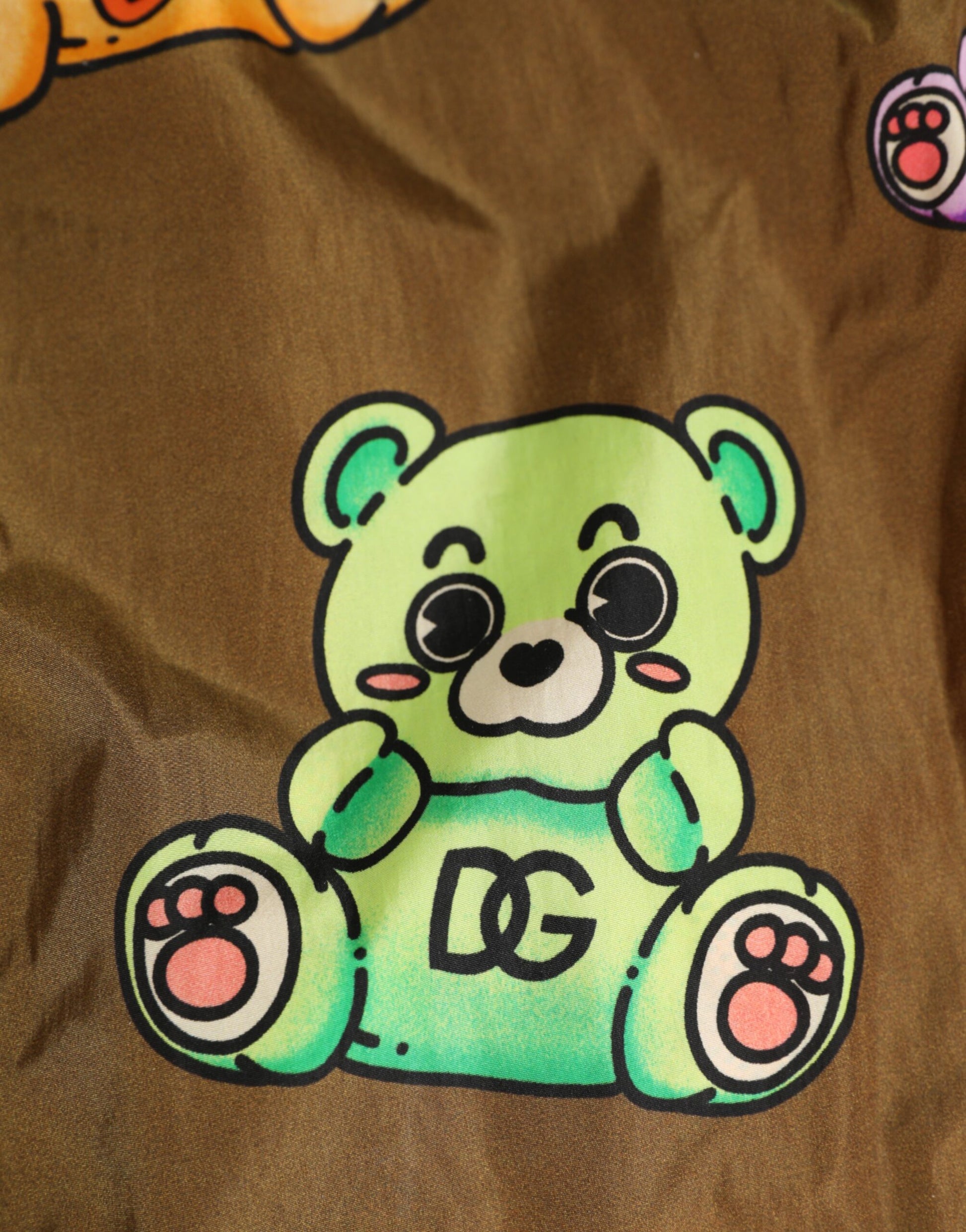 A teddy bear on a pair of men's shorts
