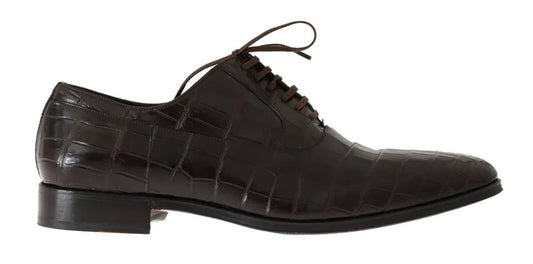 A pair of brown patterned leather dress shoes with laces and a small heel, designed by Dolce & Gabbana