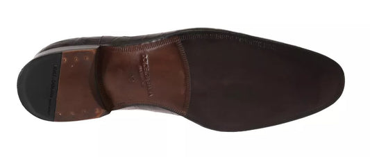 A pair of brown leather dress shoes with a patterned design, featuring laces and a small heel