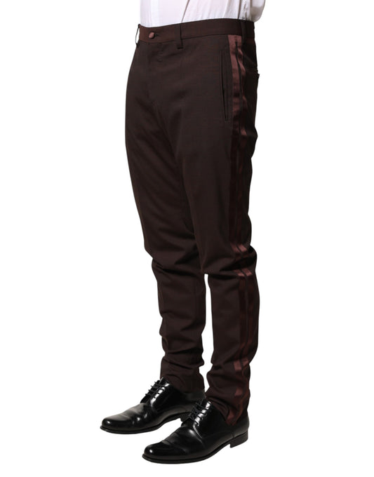 A pair of brown polyester men's dress trousers with a striped design on the sides