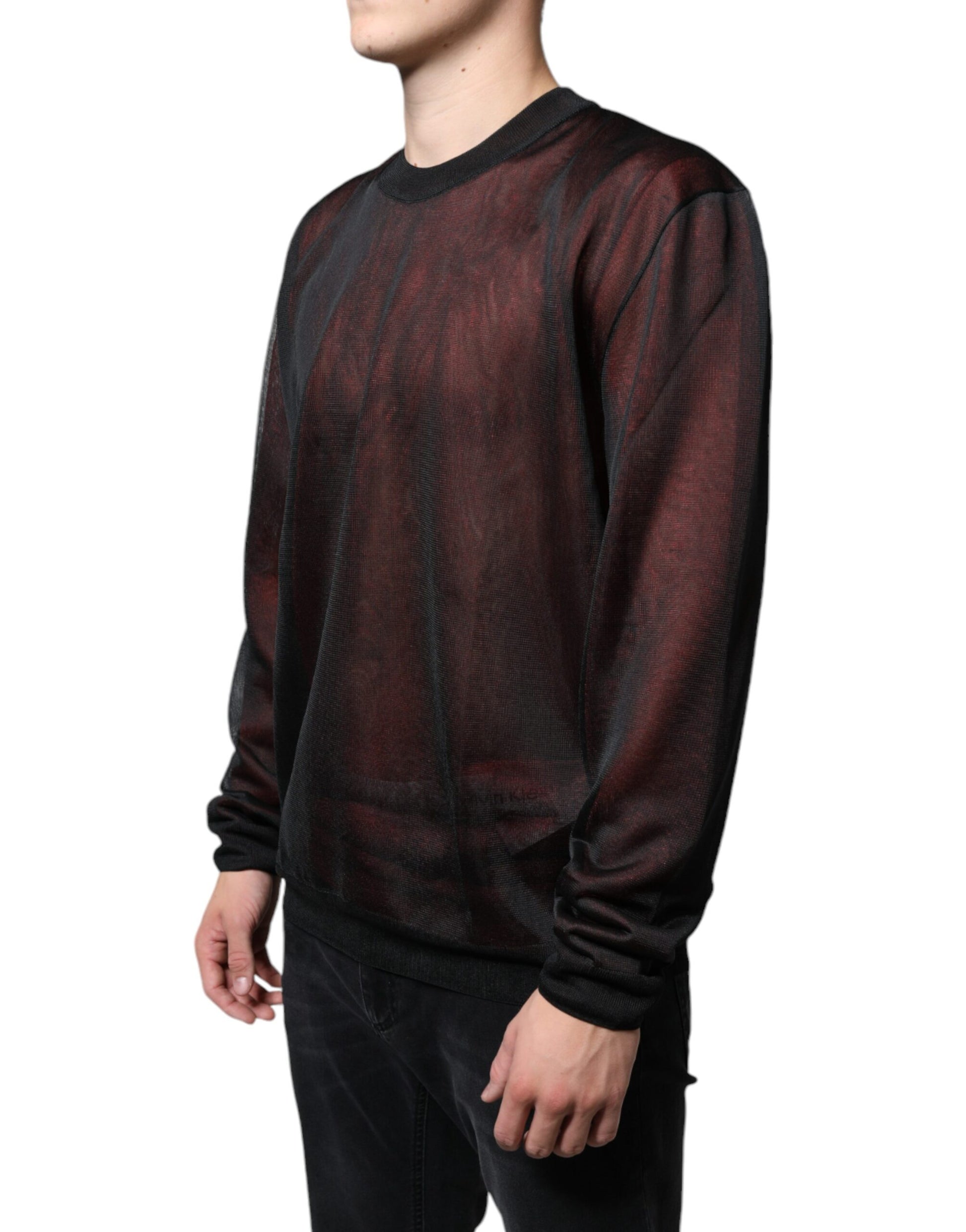 Man wearing long sleeve sweater with red and black pattern