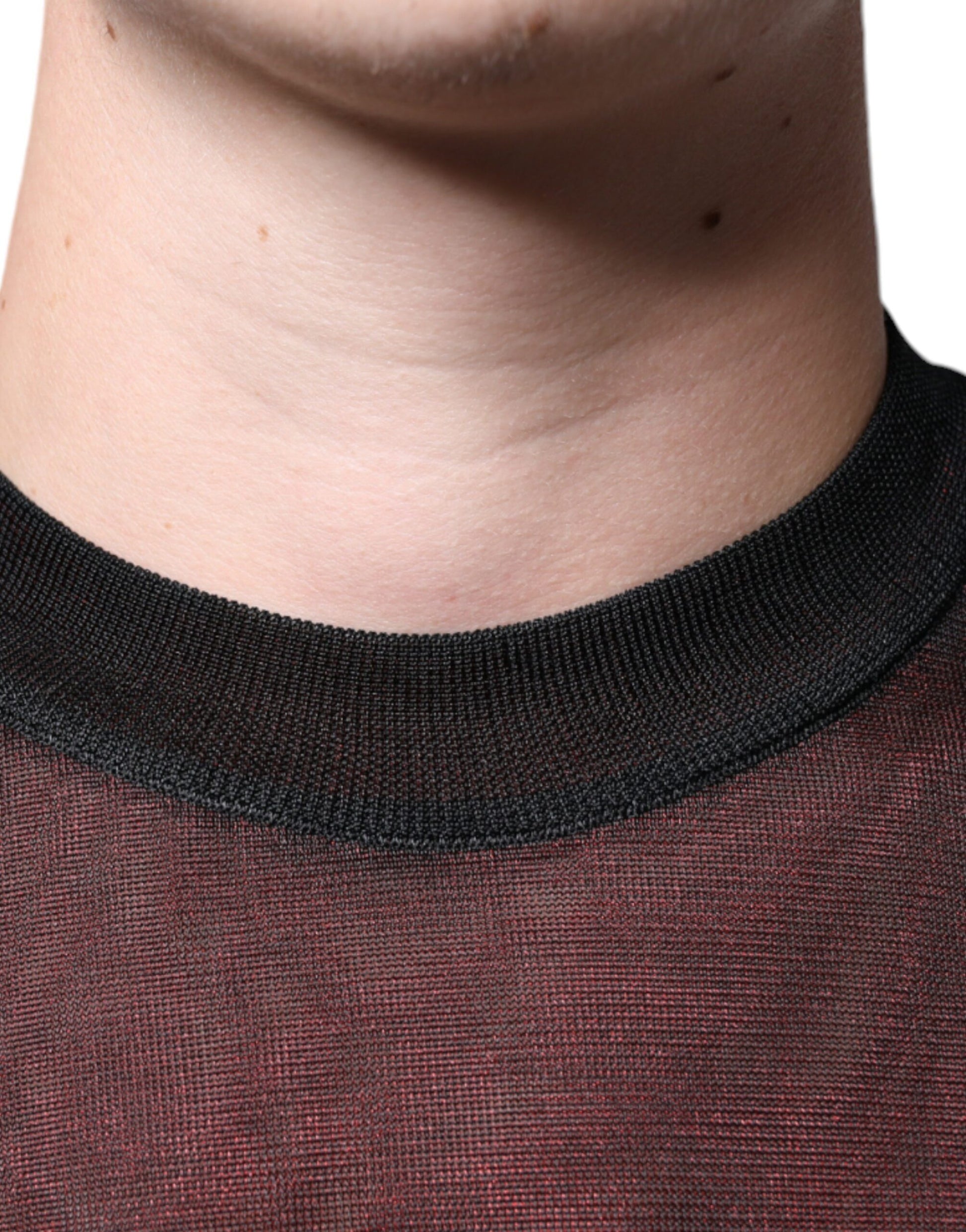 Man wearing a red shirt with black collar