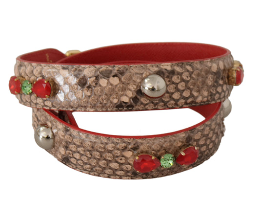 Red bracelet with gold accents and gemstones