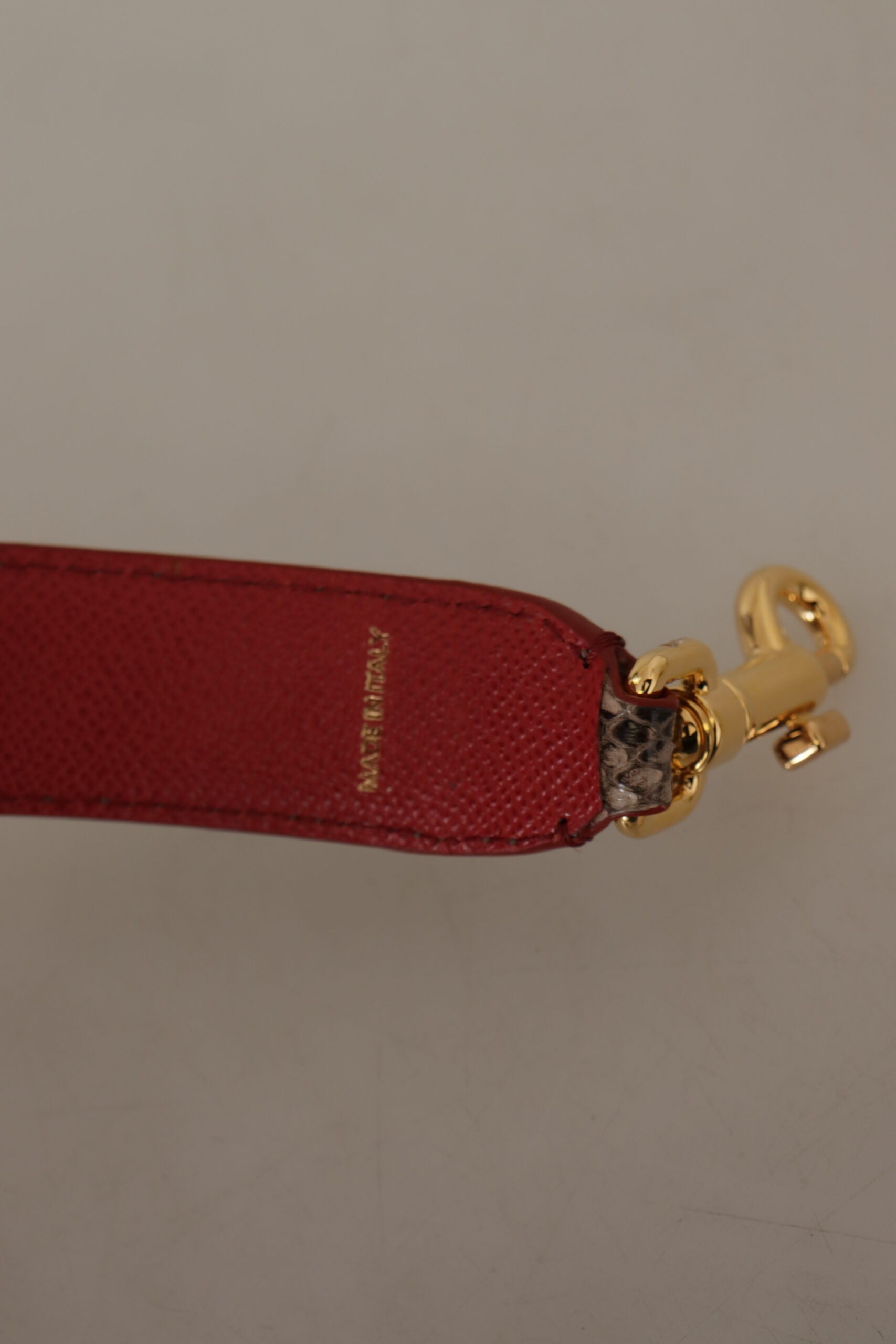 Red leather tag on a gold chain