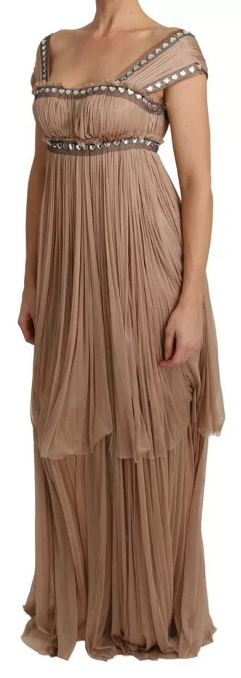 A long, sleeveless dress with ruffled detailing and a shift silhouette
