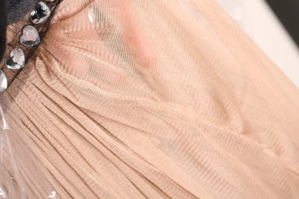 A brown silk sleeveless shift maxi dress with a sheer overlay and embellished neckline