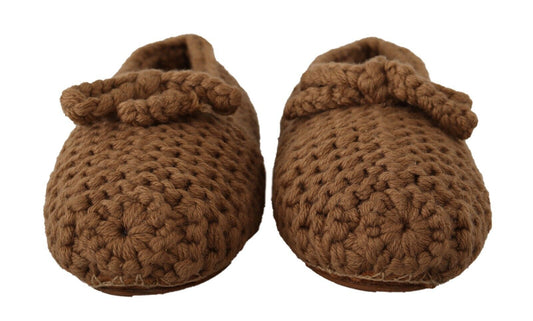 Pair of brown crocheted baby booties with ties