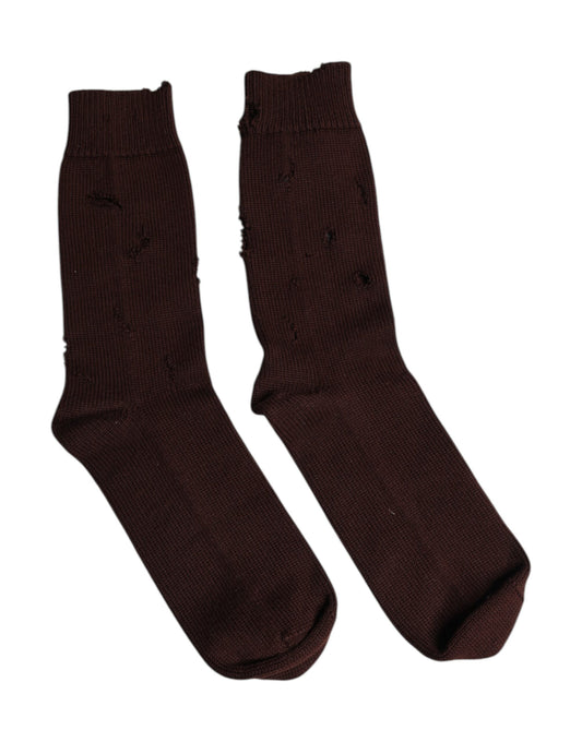 Two brown socks on a white background
