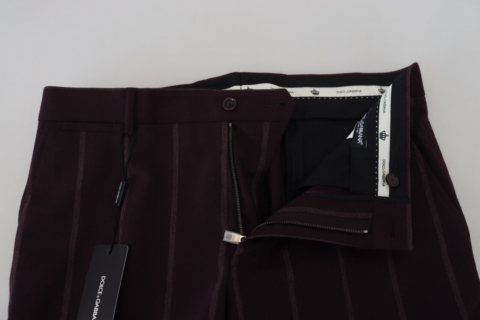 Pair of dark pants with a tag on the waistband