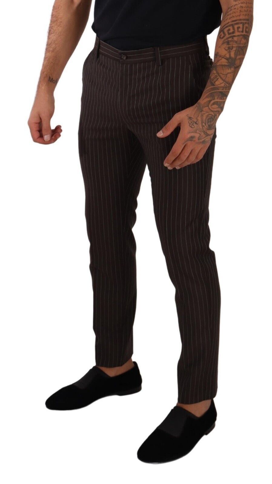 Man wearing black shirt and patterned pants