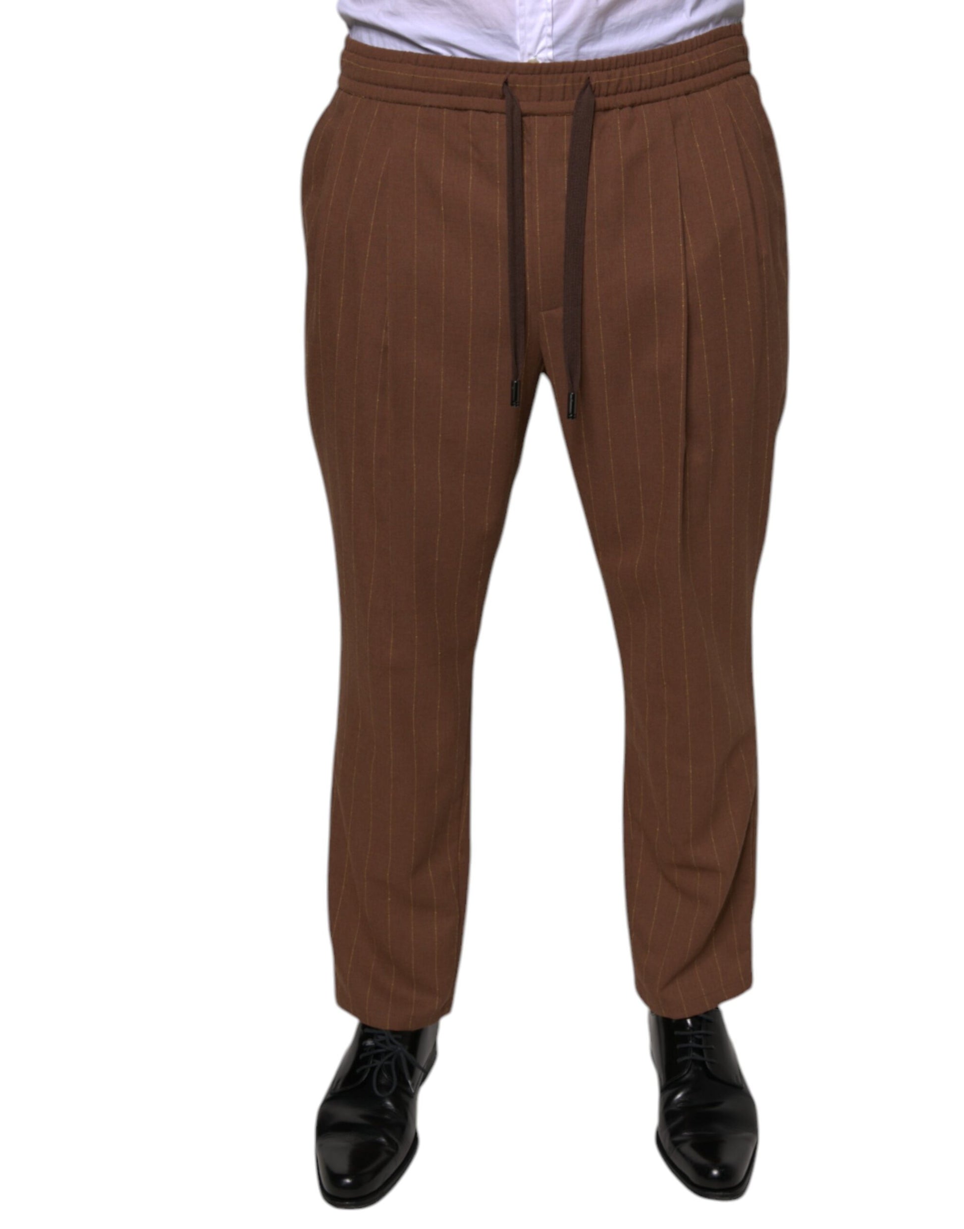 A pair of brown striped men's dress pants from the brand Dolce & Gabbana. They are designed with a skinny fit