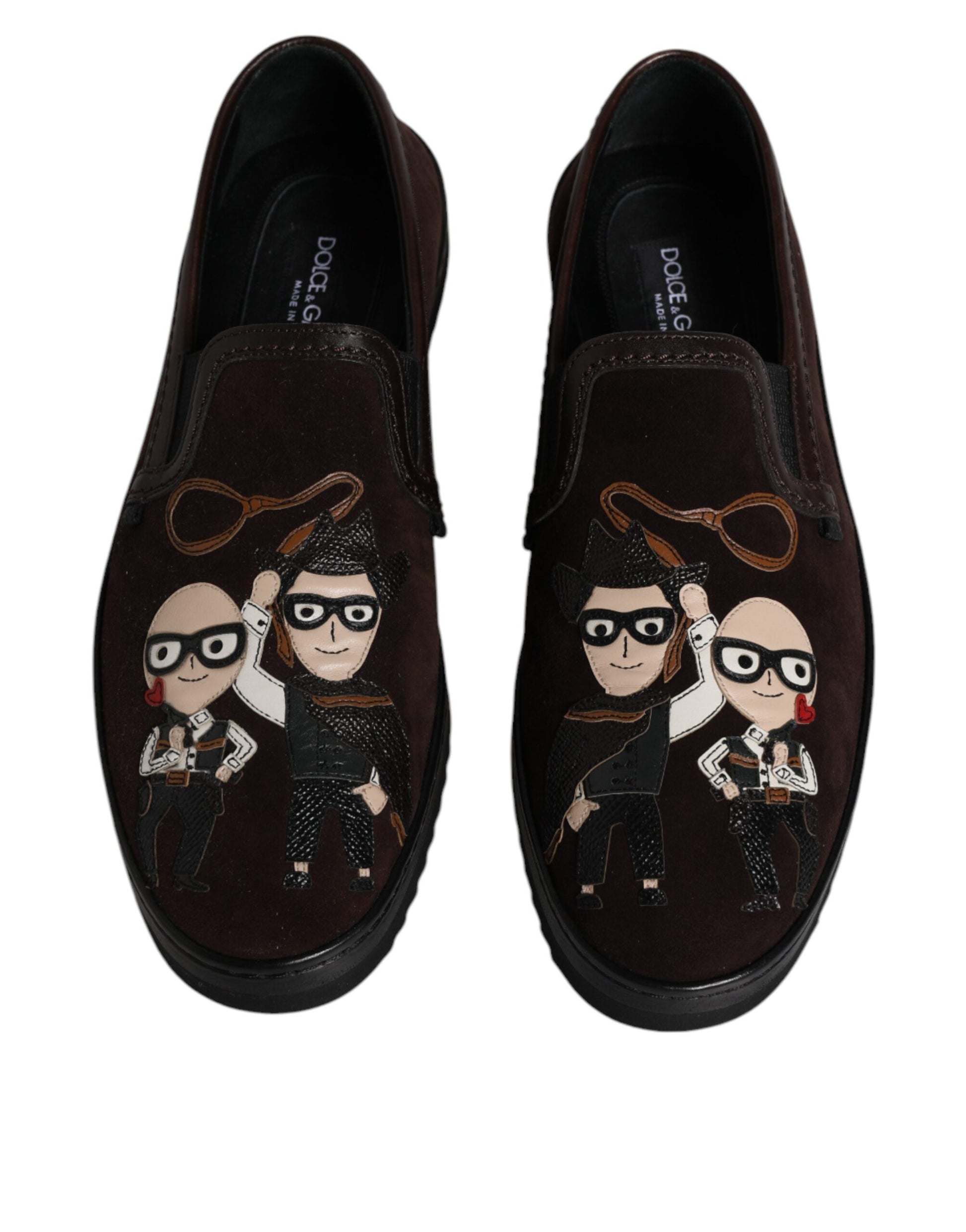 Pair of brown loafers with cartoon character designs on them